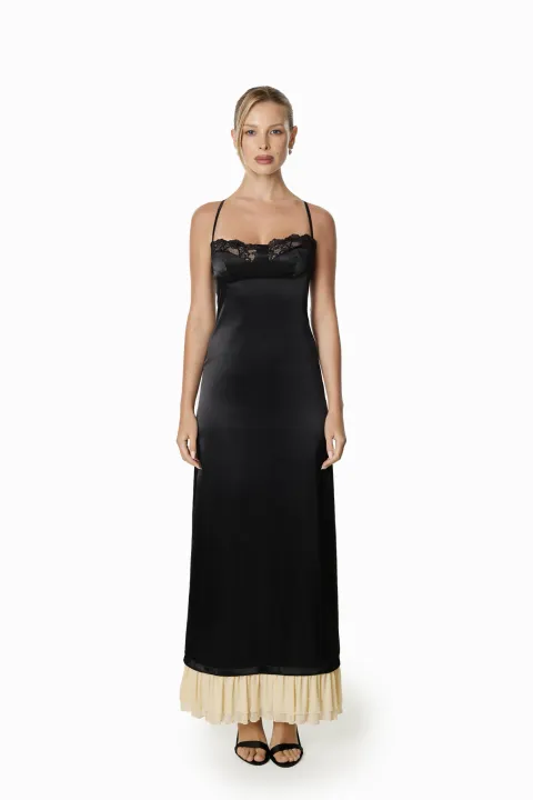 Black satin dress with beige ruffles at the hem