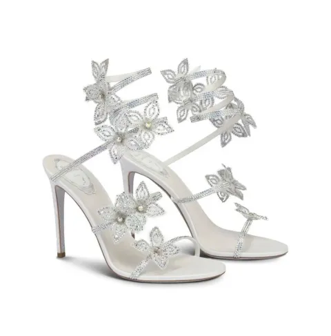 White heeled sandals with flowers and rhinestones