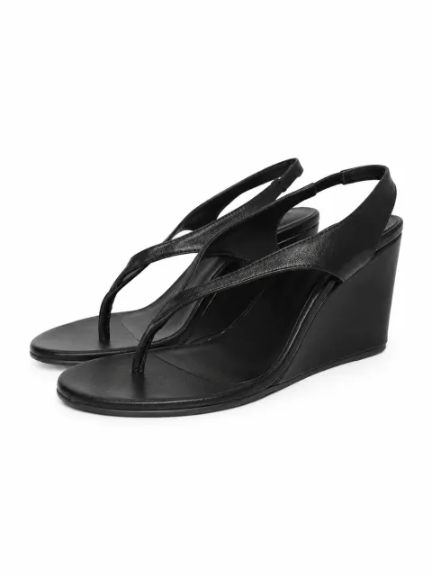 Black flip-flops on wedge