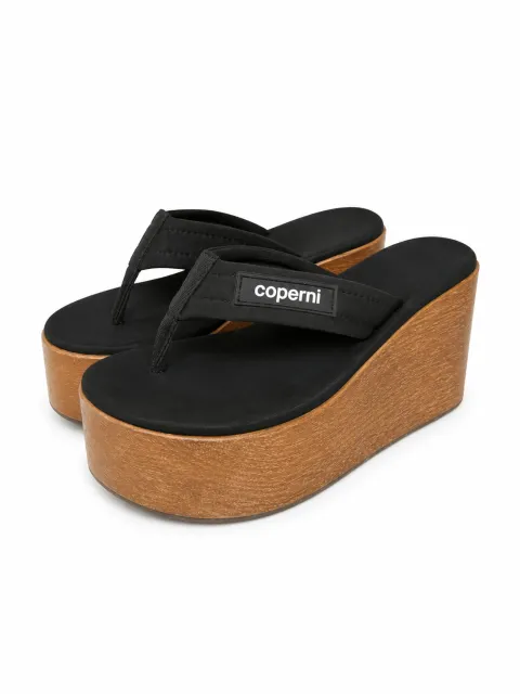 Flip-flops on wooden platform